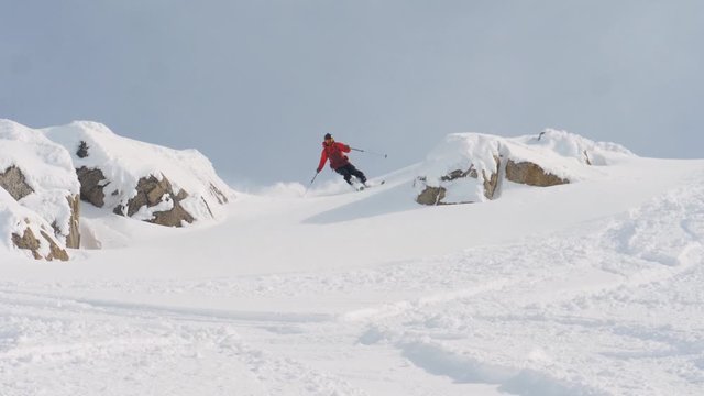 Skier descending in Powder Snow