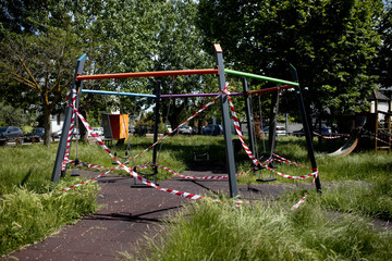 Park Closed With Warning Signal Red And White Ribbon Because Of Quarantine. Coronavirus Covid 19 pandemic period
