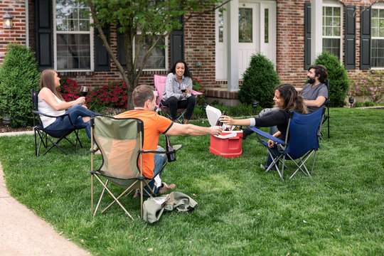 Distanced: Friend Hands Beer To Woman While Staying Apart