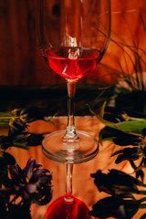 red cocktail with sparkling wine aperol whiskey juice bar
