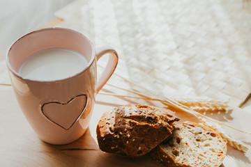 fresh summer breakfast with bread and milk, natural background