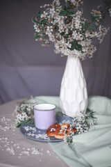 spring healthy Breakfast fried cheesecakes, against a blooming bouquet flowers