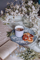 spring healthy Breakfast fried cheesecakes, against a blooming bouquet flowers
