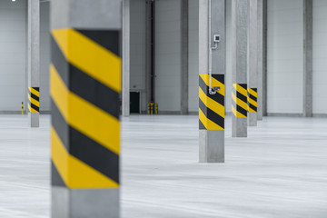 Clean and empty industrial hall in detail for supporting poles