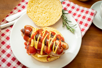 overhead shot of fried breakfast American sausage egg tomatoes roll coffee quick tasty first healthy big portion
