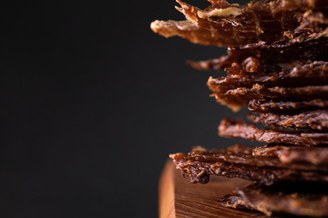 Close-up of a piece of meat on a wooden Board with spices. Restaurant menu, a series of photos of different dishes