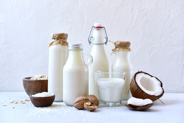 Alternative types of vegan milks in glass bottles.