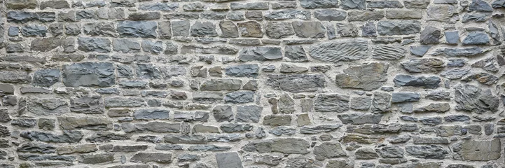 Fotobehang Old weathered stone wall © medwedja