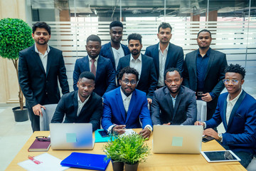international business company of nine african american and indian people developing a strategy of...