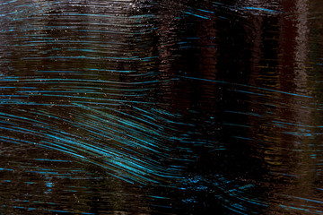 The texture of the painted metal is blue and black. Blue and black