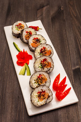 Korean roll Gimbap(kimbob). Steamed white rice (bap) and various other ingredients. Trendy black background