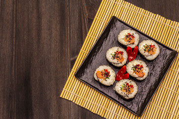 Korean roll Gimbap(kimbob). Steamed white rice (bap) and various other ingredients. Trendy black background