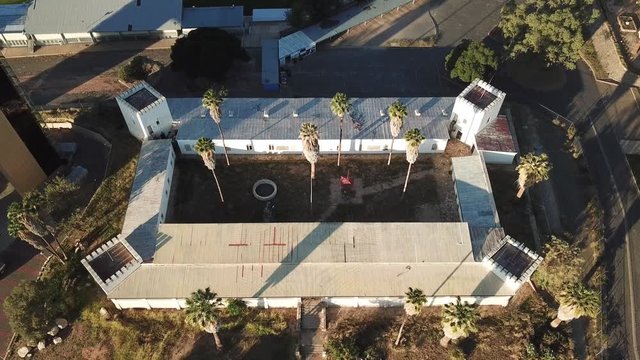 4K aerial drone summer sunset video of Windhoek old vintage Alte Feste Old Fort in city center in Namibia's capital in central highland of Namibia, southern Africa