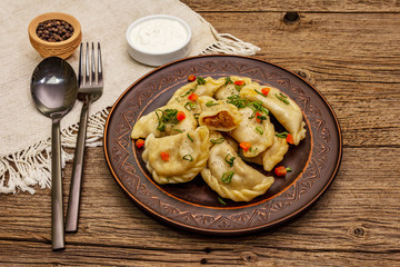 Dumplings stuffed stewed cabbage and sour cream. Traditional Ukrainian dish varenyky