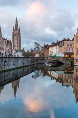 Fototapeta premium Bruges, Belgium iconic medieval houses, towers and Rozenhoedkaai canal. Classic postcard view of the historic city center. Often referred to as The Venice of the North. West Flanders province, Belgium