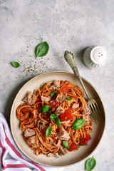 Pasta spaggeti with tuna and tomato sauce. Top view with copy space.