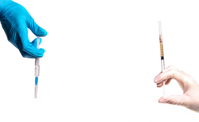 Hands in medical gloves hold a syringe with medicine on a white background