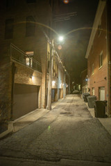 Dark and eerie urban city alley at night