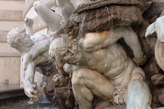 Plastic pose and dramatic expression in this fountain at the entrance of Palace Hoffburg, Wien
