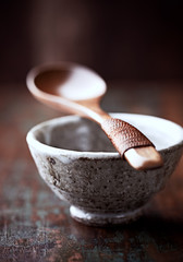  Traditional, handcrafted ceramic. Rustic wooden background. Close up.