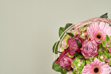 Beautiful flowers bouquet with rose and gerberas on a plain color background