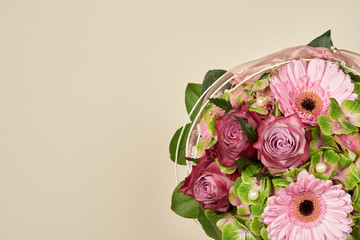 Beautiful flowers bouquet with rose and gerberas on a plain color background