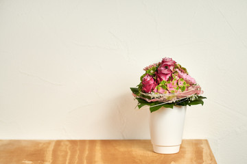 Beautiful flowers bouquet with rose and gerberas in the white vase