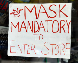 After shelter in place orders are relaxed and retail stores begin to reopen in the COVID-19 coronavirus pandemic, many shops require customers to wear a mask to enter