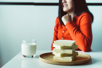 Woman refusing white bread,Female having allergy to bread,Food intolerance defined concept