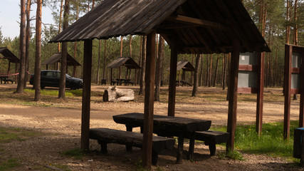 Fototapeta na wymiar Wooden picnic houses in the Gor Sokolich reserve in Olsztyn. Free space for an inscription