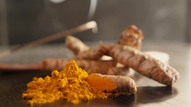 Healthy Fresh Rhizome Of Turmeric Roots Curcuma Longa And Ground Powder On The Table.