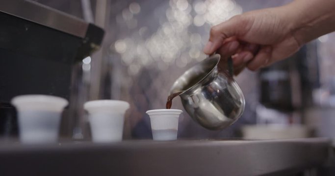 Woman preparing cuban coffee