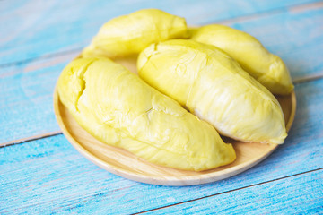 Durian fruit fresh from tree peel on wooden plate - Ripe durian tropical fruit summer for sweet dessert or snack in Thailand