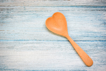 Wooden spoon on wooden table background , top view - Coffee spoon heart shape , Love health or love...