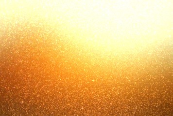 Glitter golden yellow blur texture. Shimmer background.