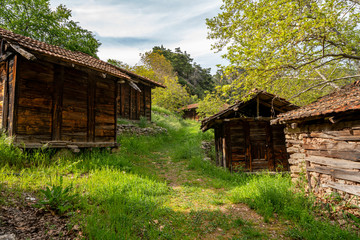 Fototapeta na wymiar the old mill named Sinan degirmeni and old wooden grain houses near the river in Caglarca, Antalya