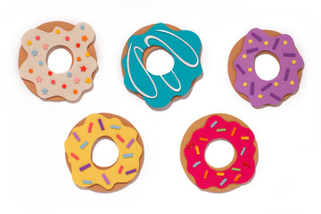 Handmade colorful paper cutout donuts for your design. Set of desserts. On isolated background. 