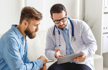 Male doctor explaining diagnosis to patient
