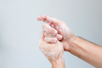 Fototapeta premium Washing hands rubbing with soap man for coronavirus, hygiene and desinfecton for prevention. Lock down, covid19. Antibacterial. Alcohol gel