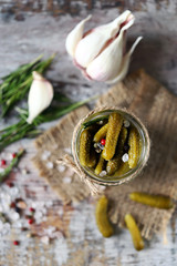 Selective focus. Pickled cucumbers jar. Macro. Gherkins in a jar.