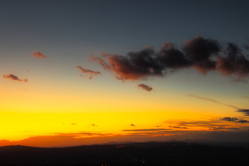 2020-05-10 BRIGHT SUNSET WITH DARK CLOUDS IN EARLY NOVEMBER IN TUSCANY ITALY