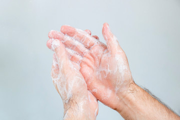 Washing hands rubbing with soap man for coronavirus, hygiene and desinfecton for prevention. Lock down, covid19. Antibacterial. Alcohol gel