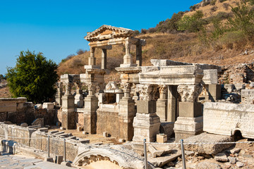 Fototapeta na wymiar Kusadasi, Turkey - April 28, 2019: People visiting Celsus Library and old ruins of Ephesus or Efes famous site