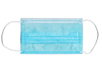 Blue medical mask protection against COVID-19, brand new mask Isolated on white. Prevent coronavirus spread. Medical equipment close-up