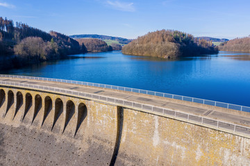 Obraz na płótnie Canvas stone water dam in the sun from above