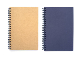 Top view above of two spiral notebooks brown and blue isolated on white background for design a mockup. Education and business concept. flat lay