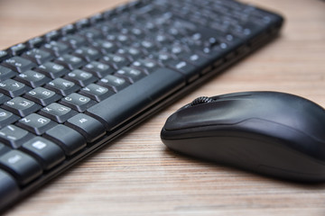 Computer black keyboard and mouse on the table
