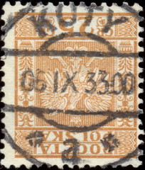 Miejscowość Koty. Rzadki kasownik / datownik pocztowy (1933) odbity na znaczku pocztowym z godłem państwowym na tle prążkowanym między ornamentami roślinnymi (25 gr, Fi.255).