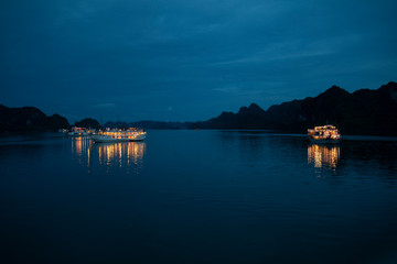 boats at night in Halong bay