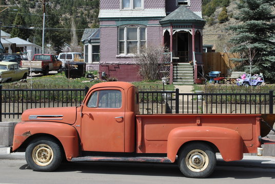 old red truck in the street